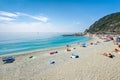 People swimming and having fun at the beach of Monterosso al Mare, Italy